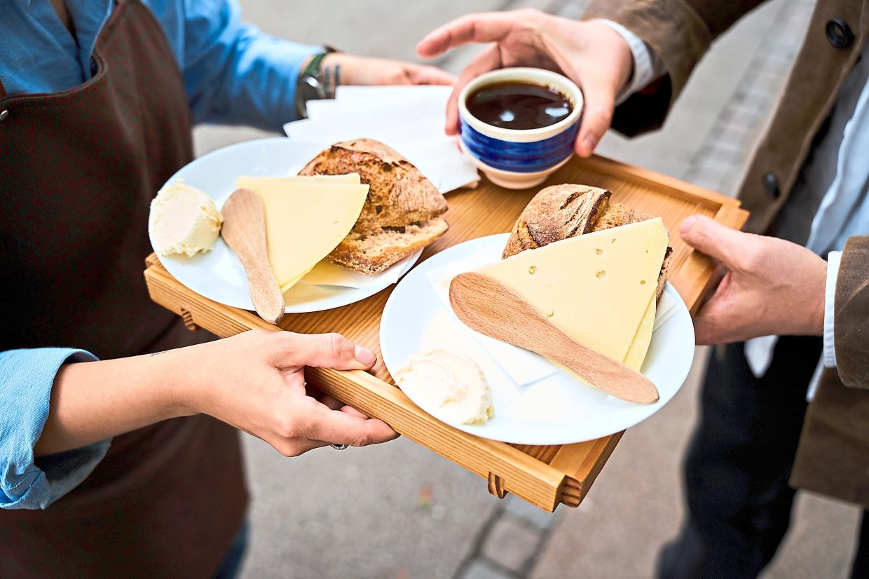At a small coffee chain, customers take a choose-your-own-adventure approach to assembling their own bolle med ost (bread with cheese).