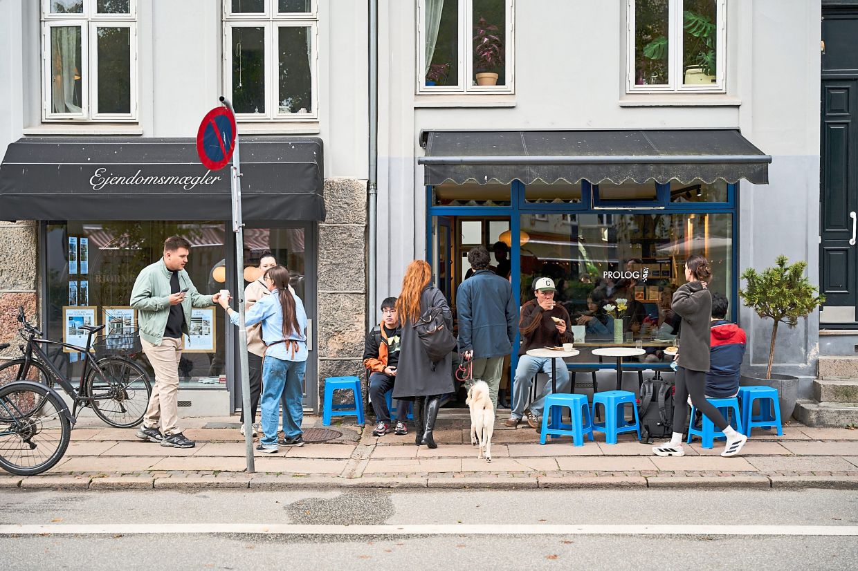 People outside Prolog, a small coffee chain, in Copenhagen, Denmark, on Sept. 25, 2026.