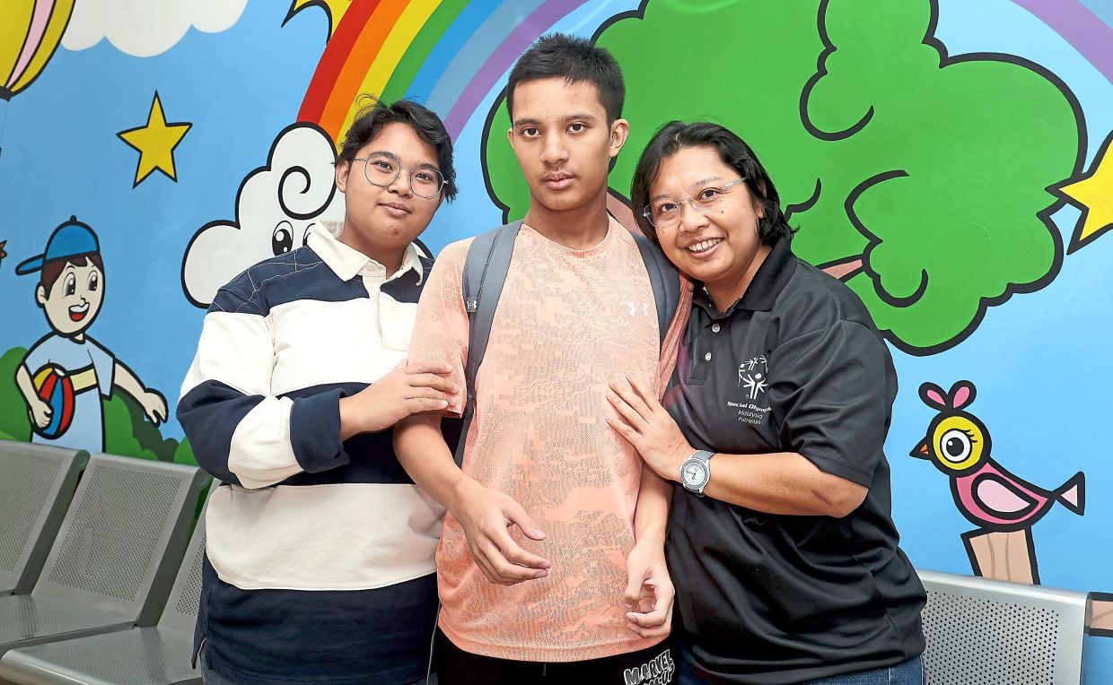 Arni Juliana (right) says understanding her children's individual needs is key to ensuring they receive the dental care they need.
