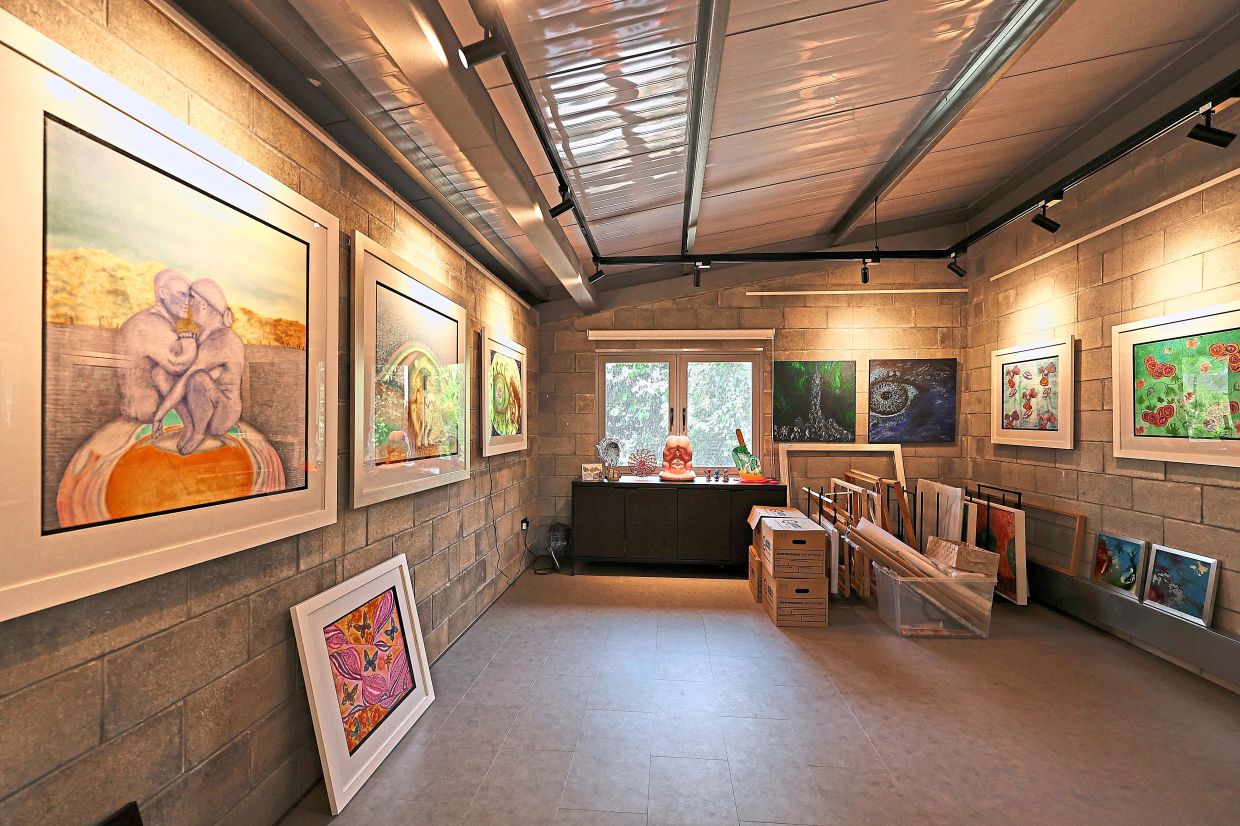 The gallery space for the homeowner's artwork was the former mechanical and electrical room.