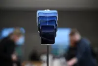 Apple says iPhone Duo demand is extraordinary. Compared with what?