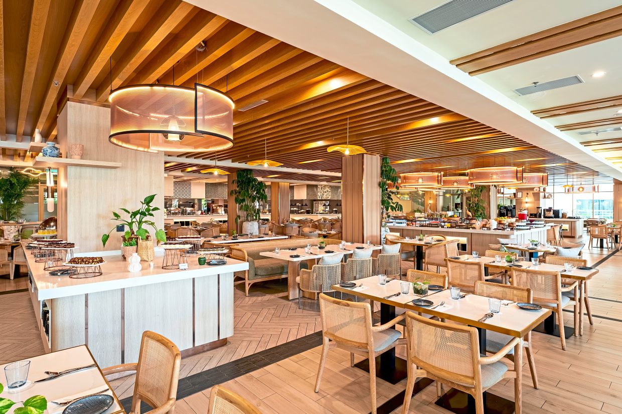 (Left) The Garden Terrace offers local and international cuisines. Swiss-Grand Beach Resort Kuantan’s swimming pool is a highlight for all in the family. — Photos: Handout