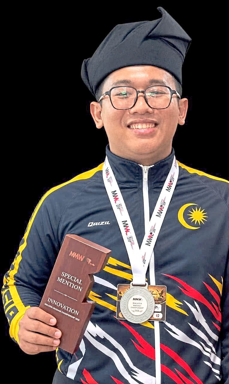 Healing hands: Muhamad Qaizil with a silver medal he was awarded with during an international massage competition held at Langkawi in 2025.