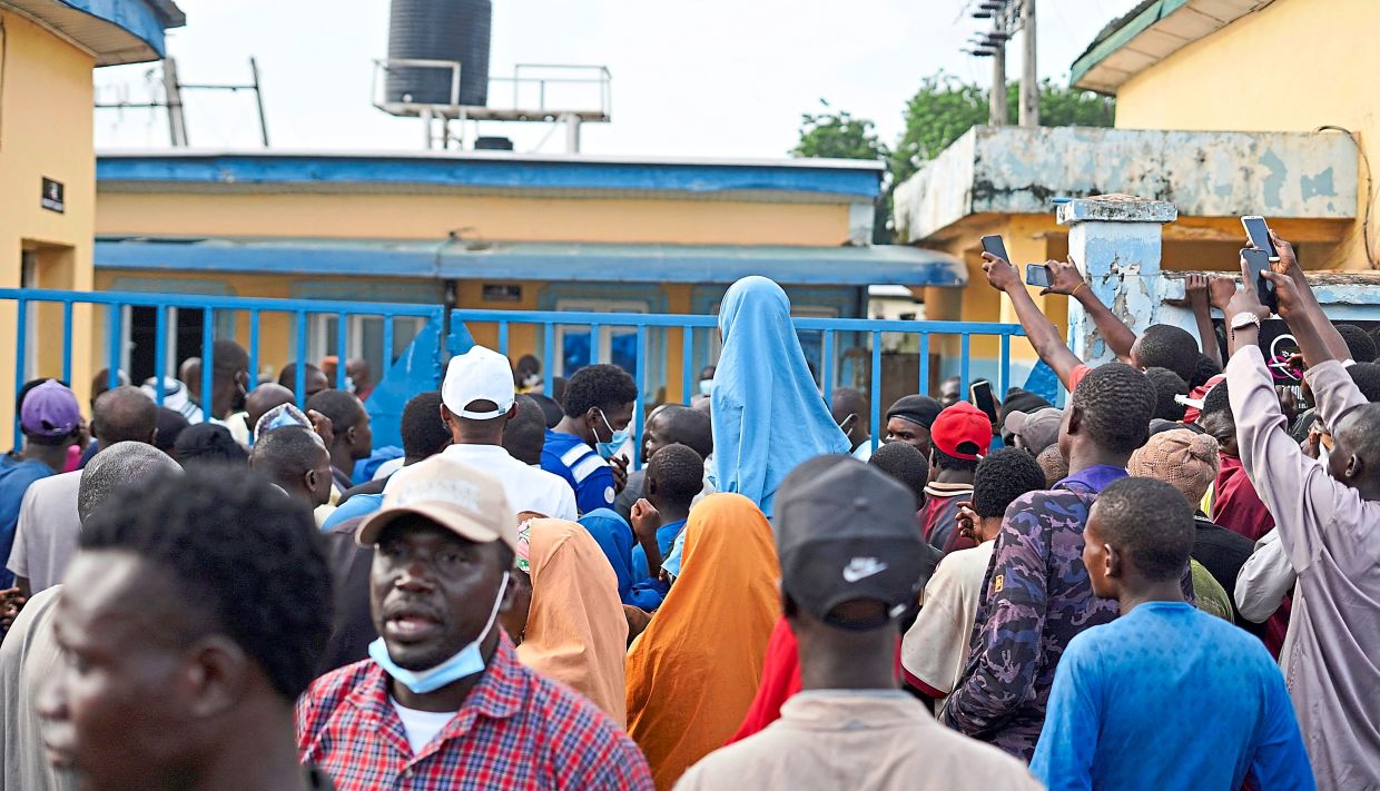 Family members of individuals arrested in mining raids who reportedly died while in detention gathering at Minna General Hospital in Minna, Niger State, Nigeria. — Reuters