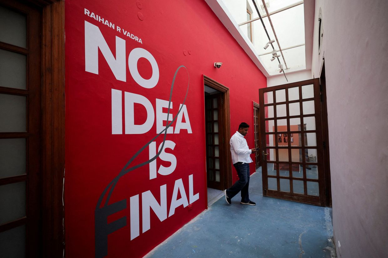 A man walks past an exhibition of photographs by Raihan Vadra, nephew of Indian opposition leader Rahul Gandhi, at Bikaner House in New Delhi. Photo: Reuters