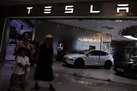 Tesla signs deal to integrate Alipay into its cars as China competition heats up