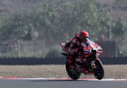 Motorcycling-Marquez shrugs off crash to take pole at wet Australian Grand Prix