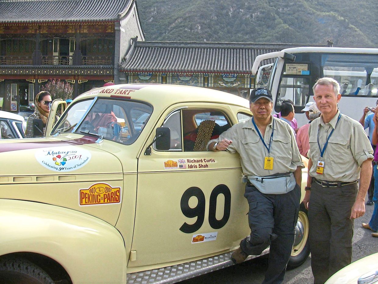 Sultan Sharafuddin and his co-driver Curtis, posing proudly in front of their vintage ride nicknamed ‘Custard Tart’, before setting off on the Peking to Paris Motor Challenge 2007.