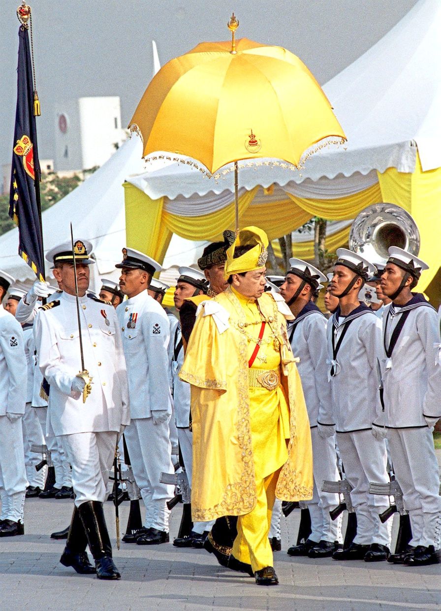 Sultan Sharafuddin inspecting a guard of honour mounted by the Royal Malaysian Navy at Istana Alam Shah’s parade grounds prior to his coronation. — Photo from S. Thinakaran, courtesy of Istana Mestika