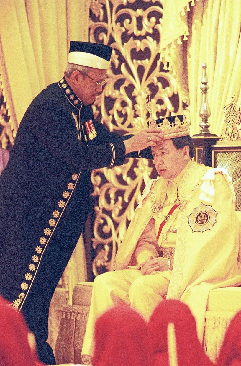 The Mufti of Selangor Dato Sahibus Samah Dato Tamyes Mohamad places the crown on to the head of Sultan Sharafuddin Idris Shah at the Coronation ceremony at Istana Alam Shah today.