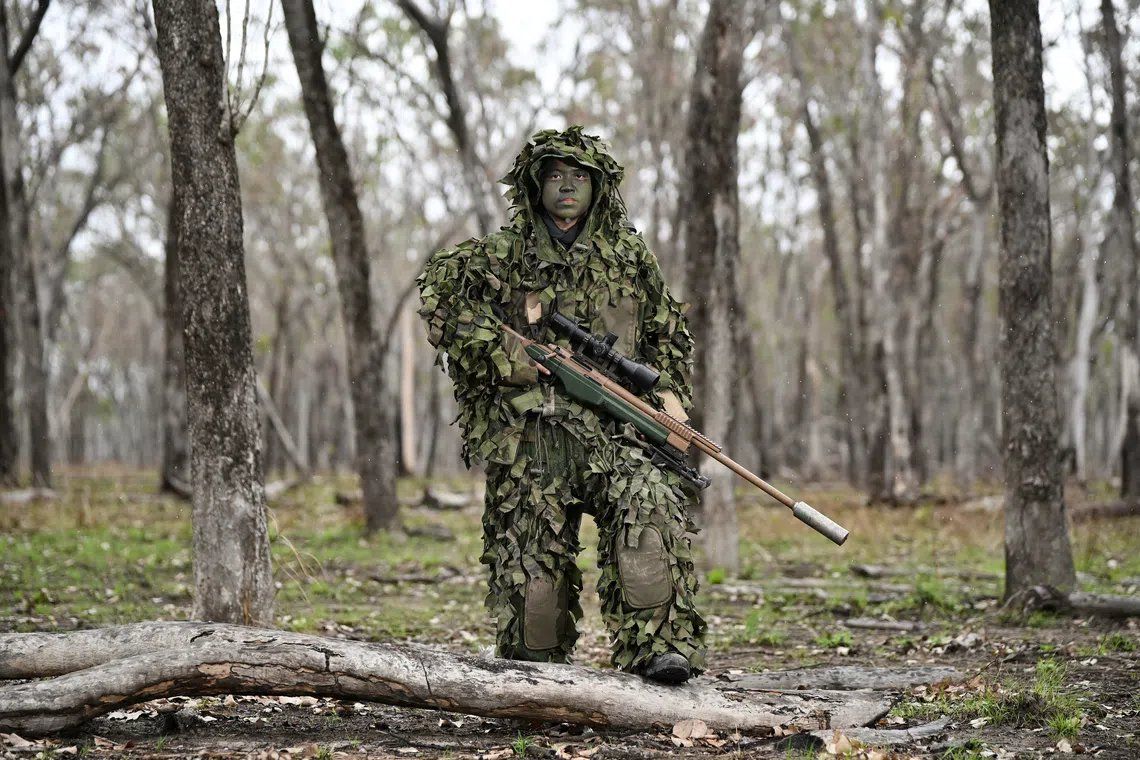 Master Sergeant Chin Shi Lee in a ghillie suit on Oct 23. - ST/ANN