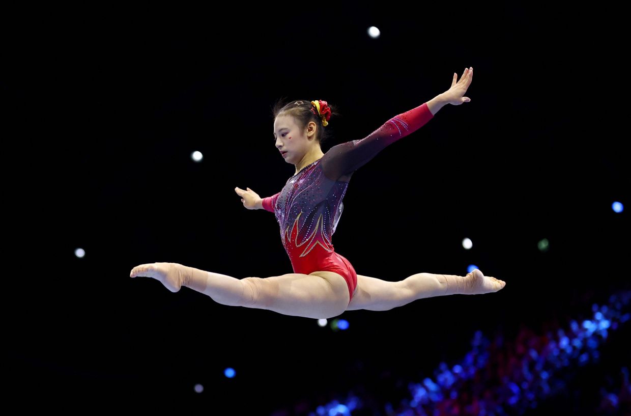 Artistic Gymnastics - 2026 World Artistic Gymnastics Championships - Rotterdam Ahoy, Rotterdam, Netherlands - Sunday, October 25, 2026. China's Qiyuan Qiu in action on the balance beam during the apparatus finals -- Photo: REUTERS/Piroschka Van De Wouw