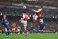 Soccer-Gabriel shines at both ends as Arsenal ease past Everton to go level with Man City