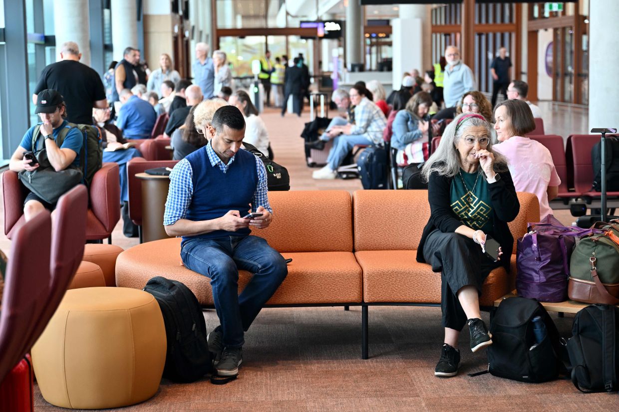 Passengers wait to board an Air New Zealand flight operating the first international departure from the newly-opened Western Sydney International Airport in Sydney on October 26, 2026. - Photo: AFP