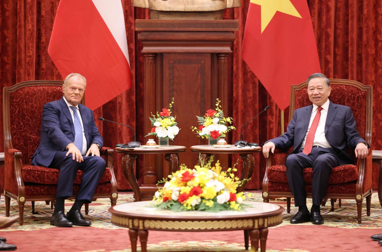 Vietnam's President To Lam (R) meets with Poland's Prime Minister Donald Tusk in Hanoi on Monday, October 26, 2026. -- Photo by Quang Nguyen / AFP