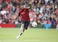 Soccer-Former Arsenal forward Pennant saved by his dog after German Shepherd attack