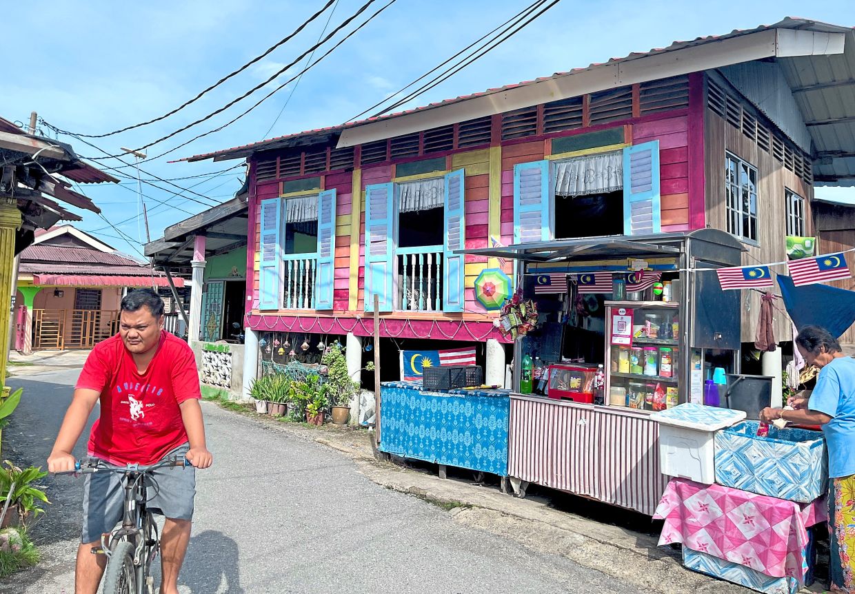 A decorated house at Kampung Warna-Warni Kuala Perlis, where residents also run small businesses to supplement their income.
