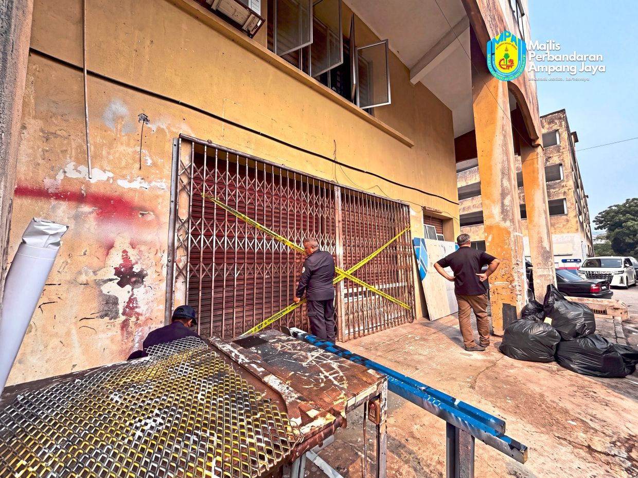 A business premises in Pandan Indah being sealed by MPAJ officers for violating licensing conditions. — Photos: Handout 