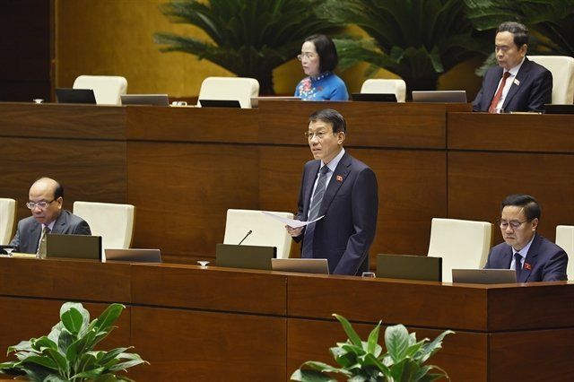 Minister of Public Security Luong Tam Quang fields the queries raised by NA deputies.