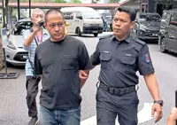 Husband tried for officer’s murder