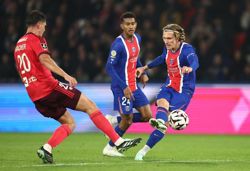 Soccer-Mayulu, Godts send PSG top with win over Olympique Lyonnais