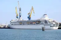 A US cruise ship ends a global voyage in Cambodia due to fuel costs and 200 passengers lose their homes