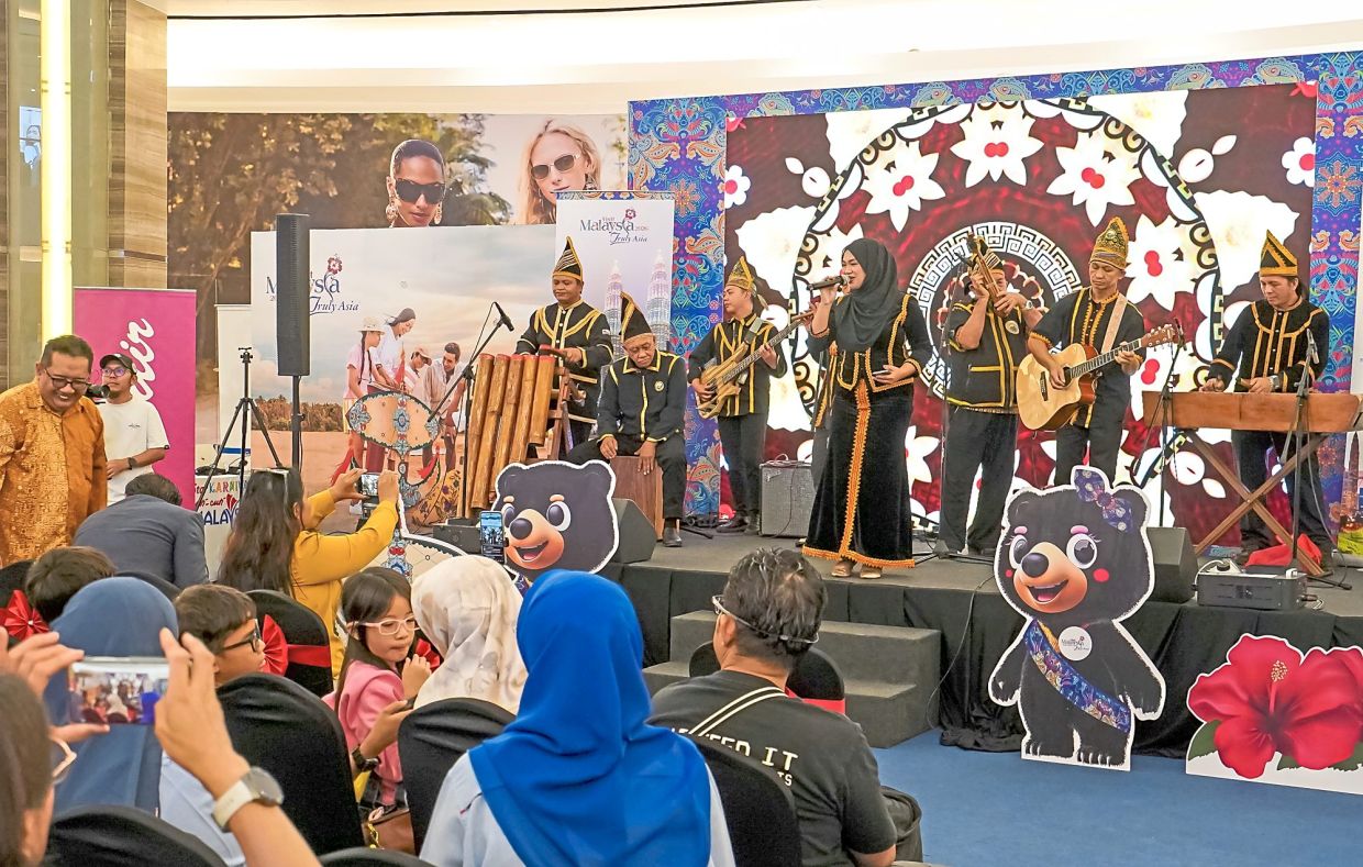 Cultural entertainment: Visitors to the SKCCM in Imago Mall in Kota Kinabalu, Sabah, back in August having a grand time during the performances.