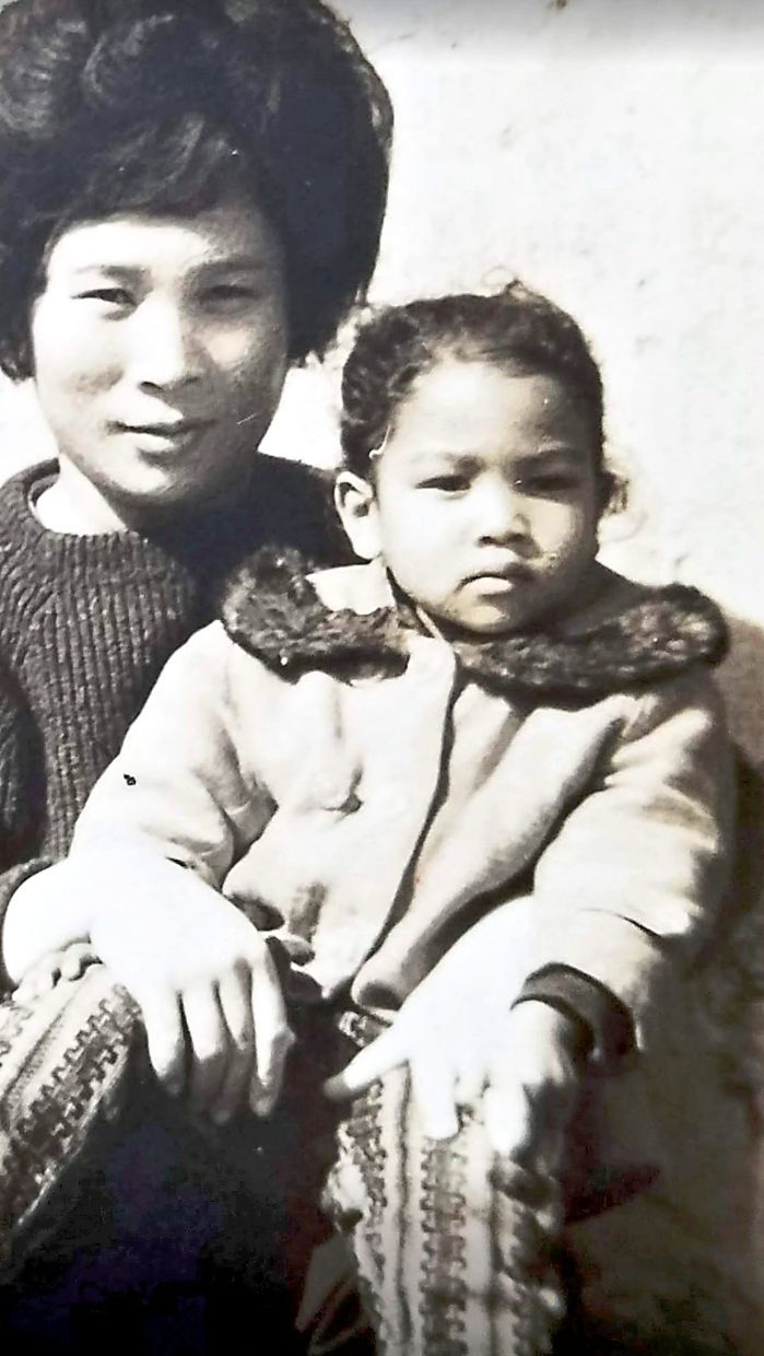 Broken ties: Jackson with her Korean mother when she was a young girl. — Photo courtesy of Liem