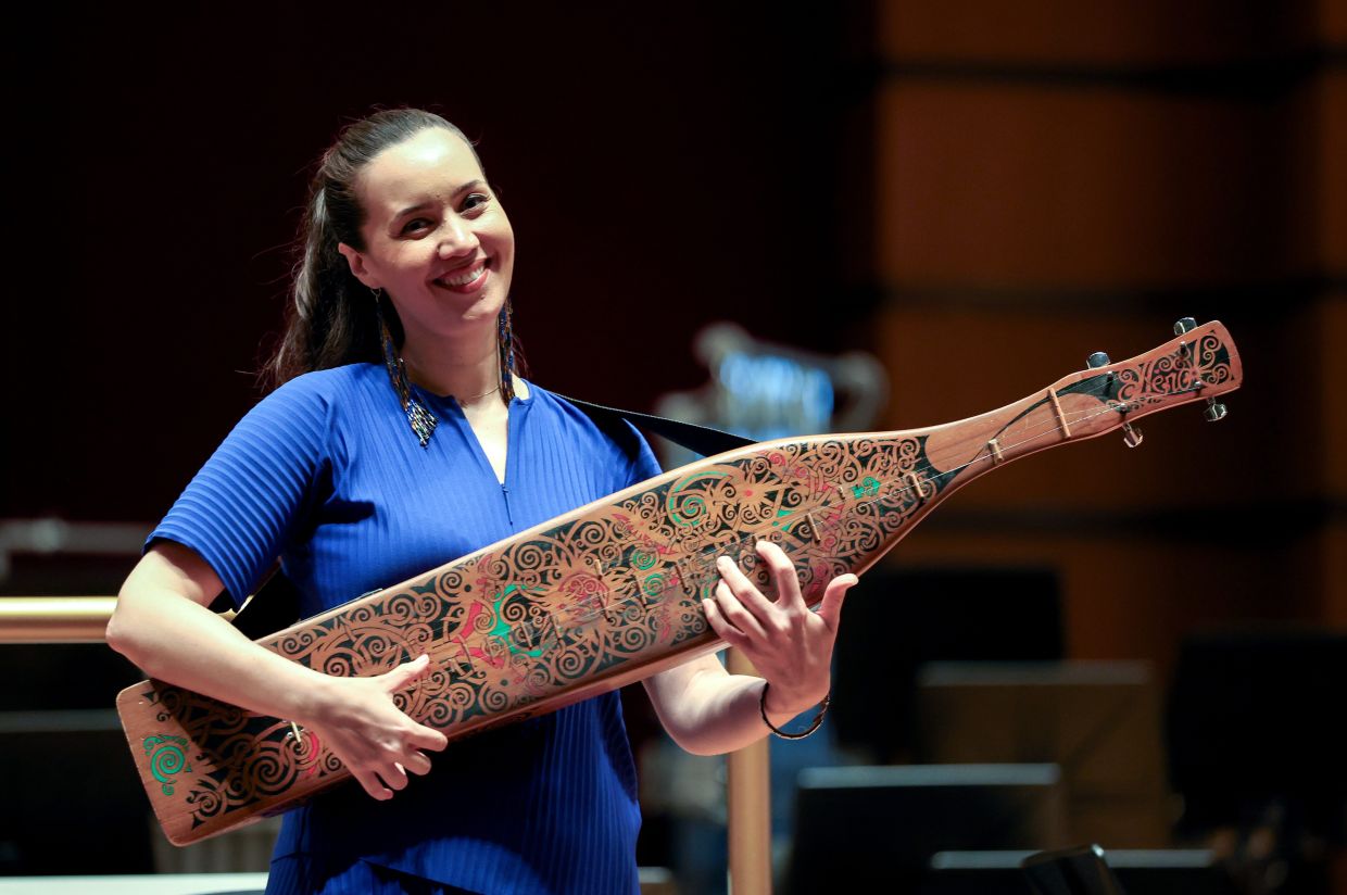 Alena returns to the DFP stage this Saturday to perform 'Concerto For Sape And Orchestra', a 20-minute, three-movement work by Sabah-born composer Chua. Photo: Bernama 