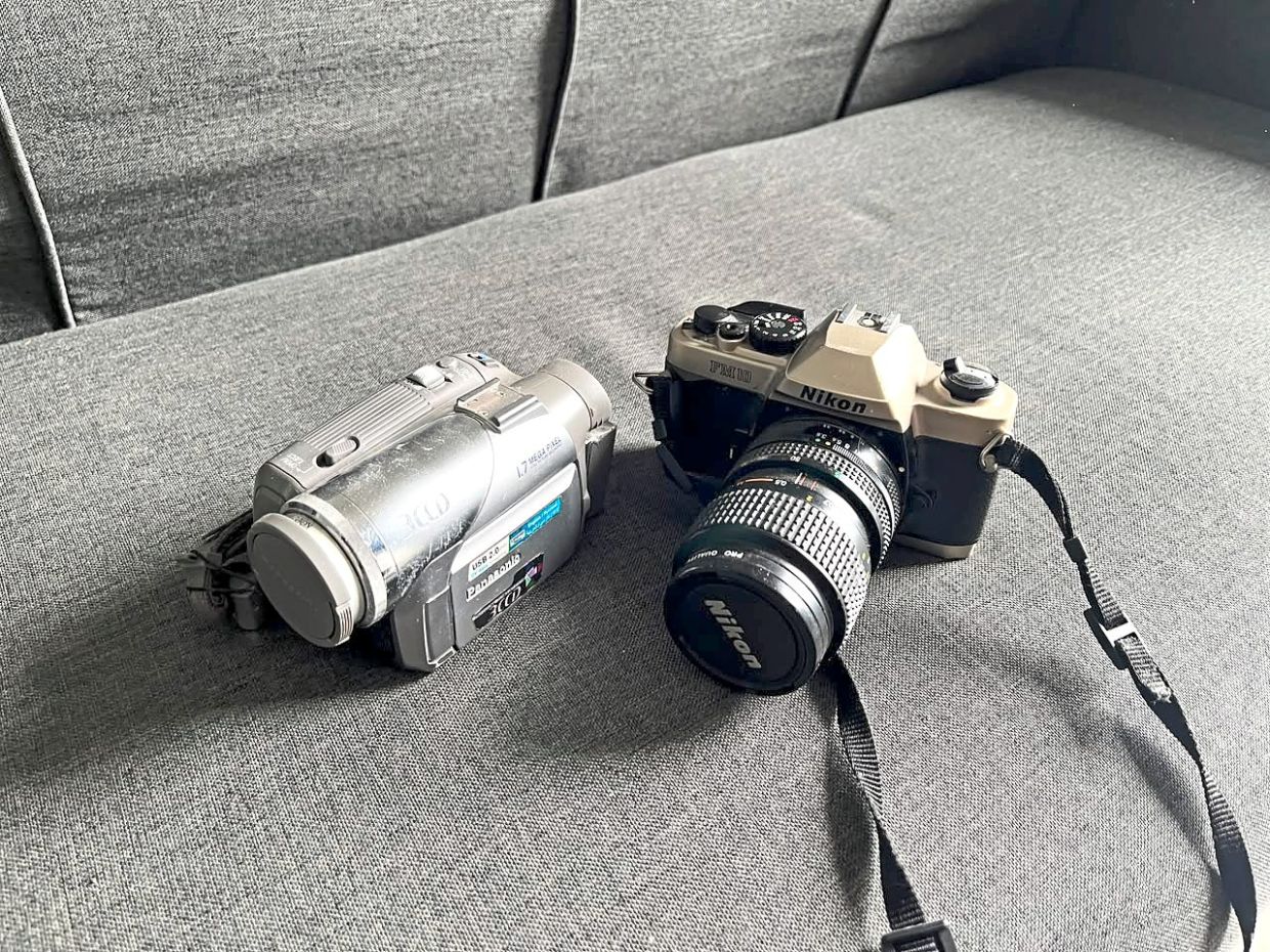 Sarhvin uses these two devices – a VHS camcorder and a film camera – to capture everyday moments. Photo: Sarhvin Rakupathi