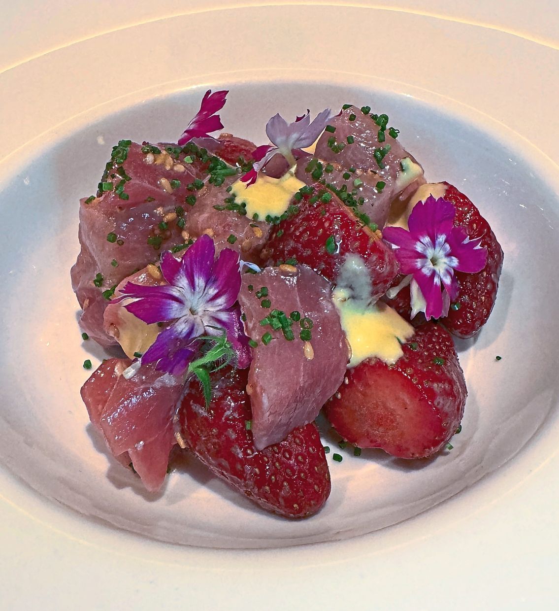Strawberries and raw tuna belly in a sweet and sour citrus sauce give the Tuna Tartare Calamansi Amazu Ponzu its unique twist.