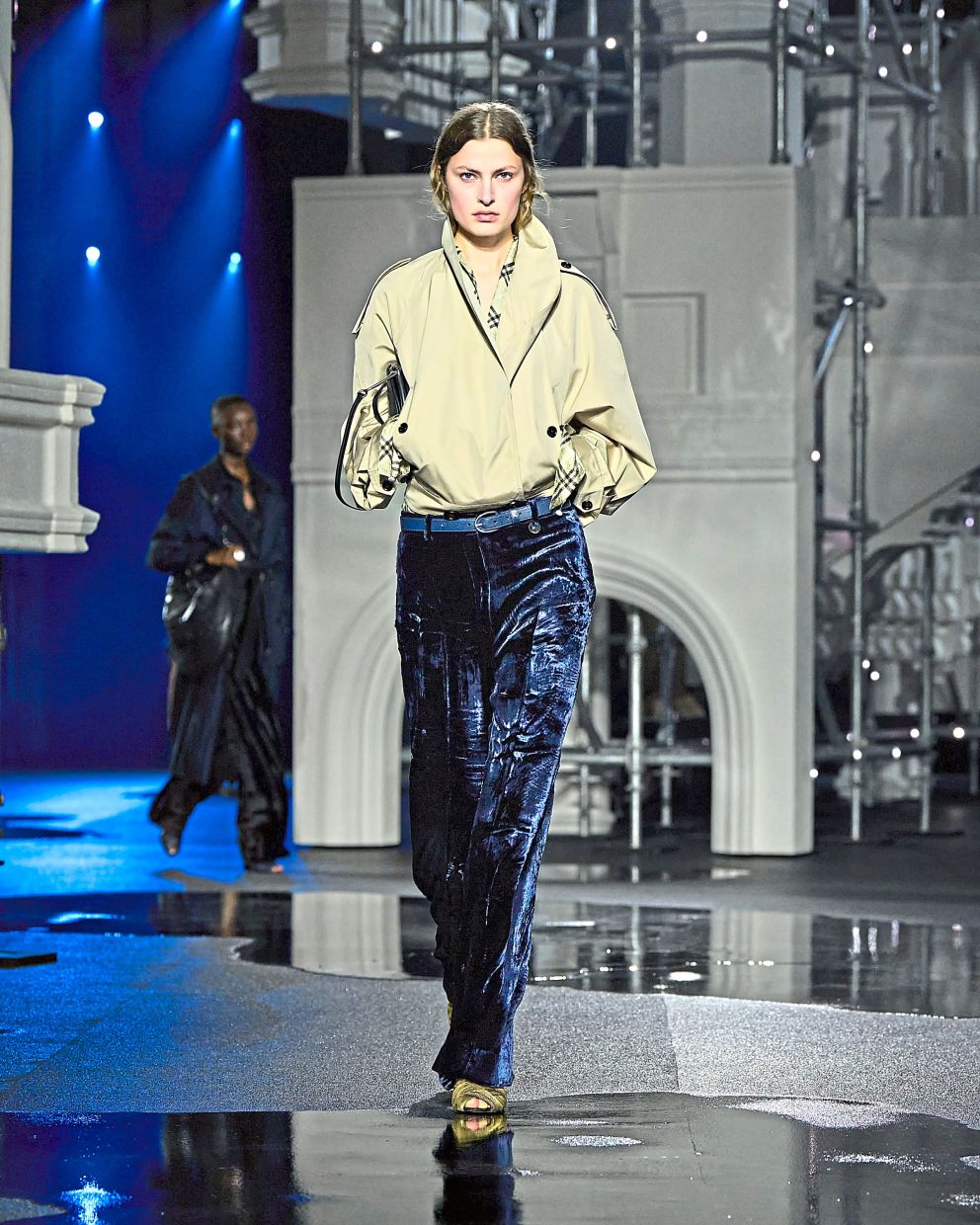 The combination of a low-key top and light-catching midnight blue trousers makes this look both wearable and striking. Photo: Burberry
