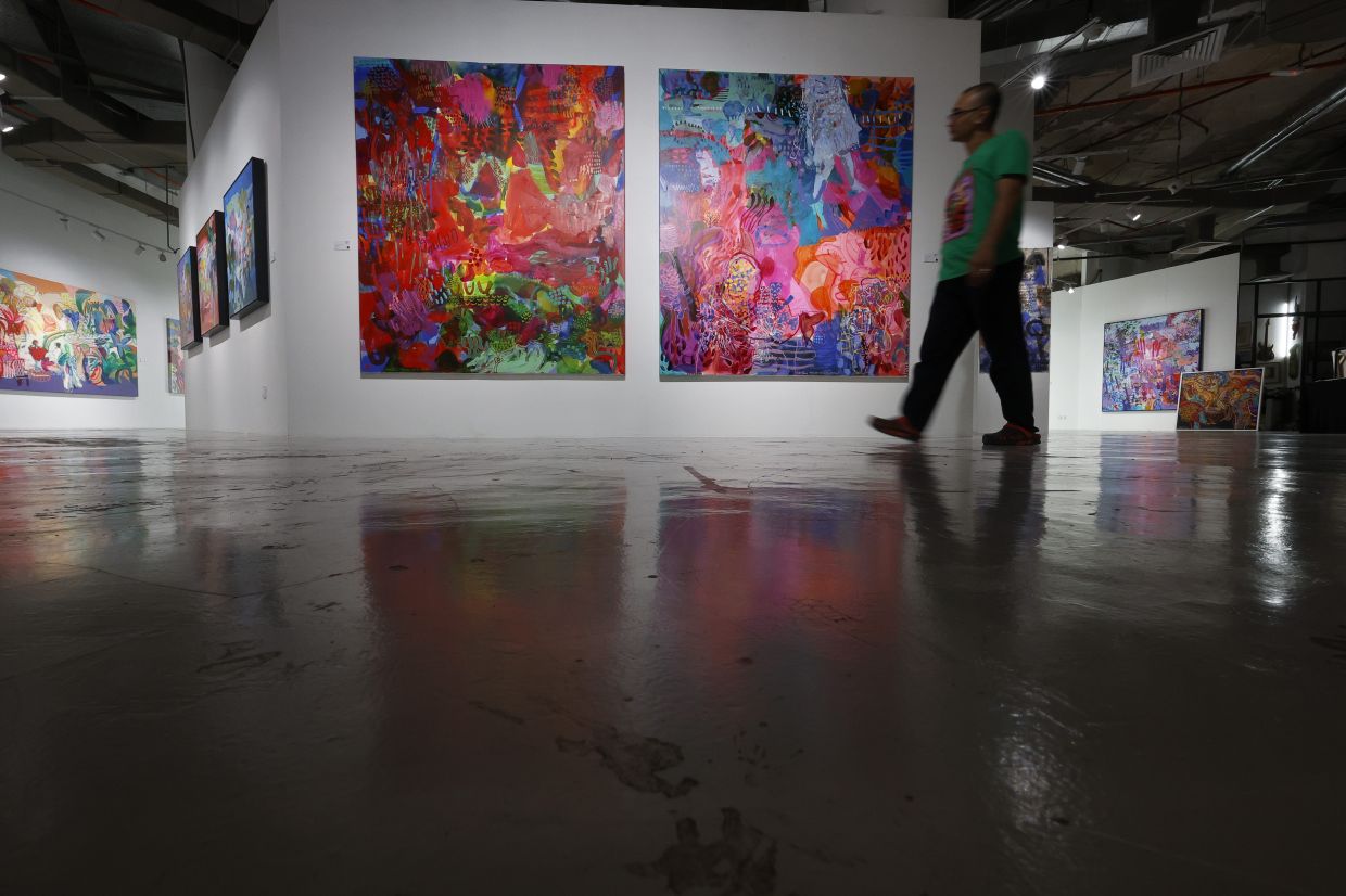 A view of Rafiee's new exhibition 'Dusun Laut' at Galeri Puteh in Kuala Lumpur, featuring mixed media paintings and a charcoal on paper series. Photo: The Star/Faihan Ghani
