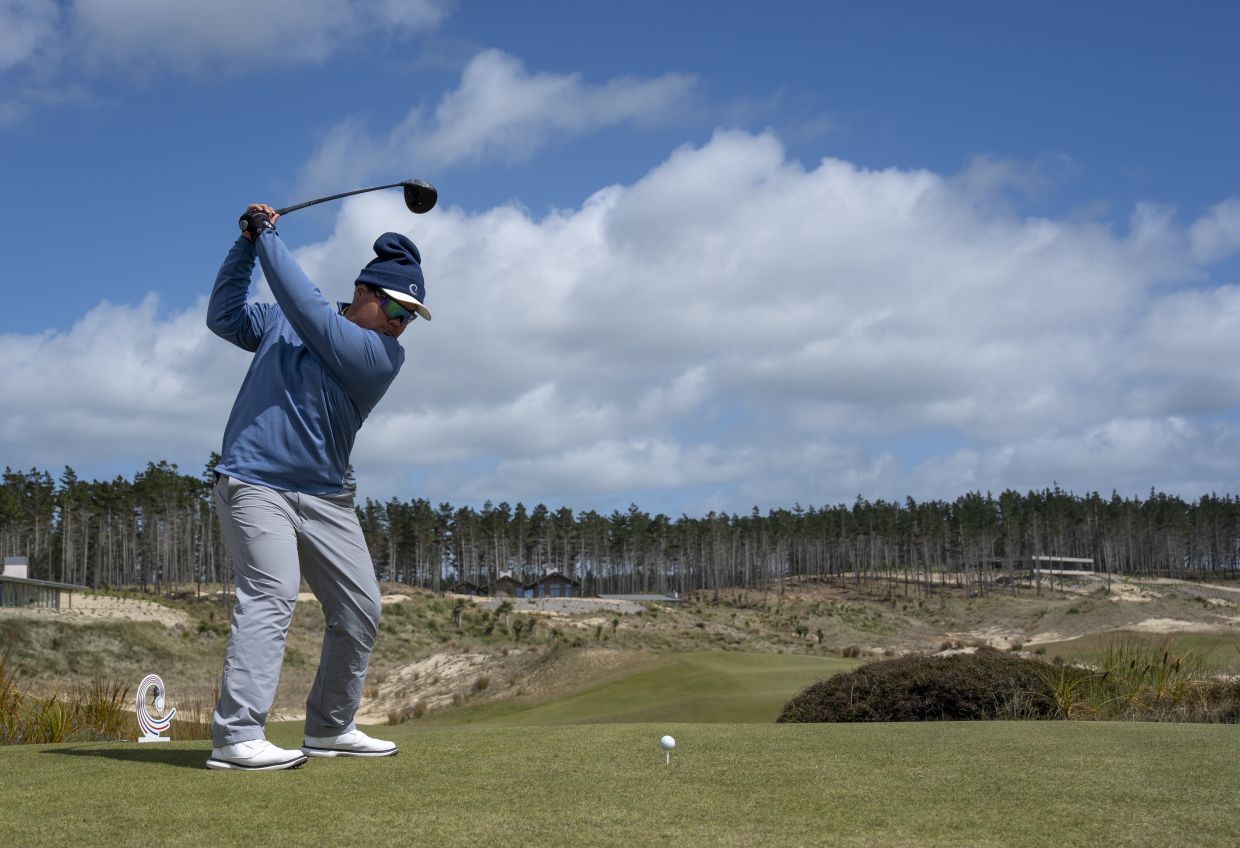 Danish Rizal of Malaysia plays his stroke from the No. 13 tee during the second round of the 2026 Asia-Pacific Amateur Championship, being played at the Te Arai Links, South Course in Auckland, New Zealand, on Friday, Oct 30, 2026. -- Photograph by AAC.