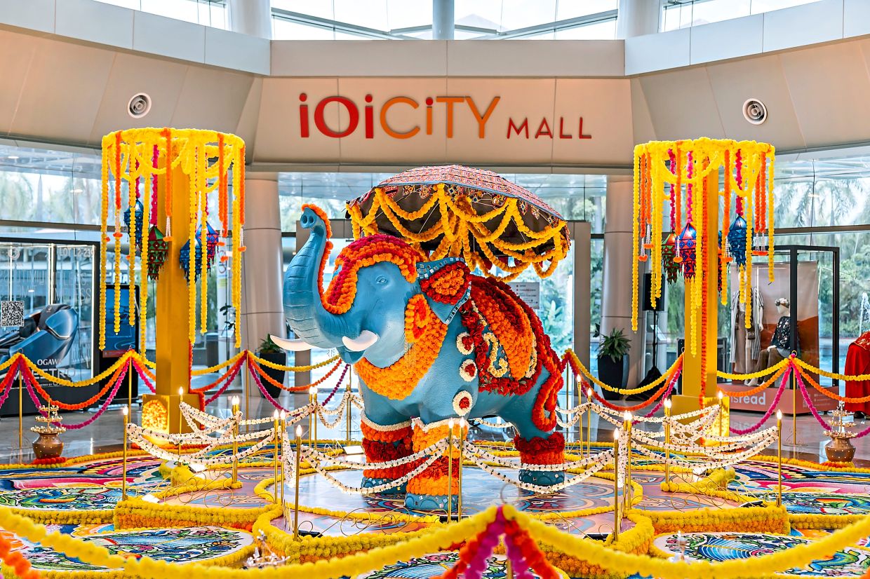 A large blue elephant decorated with flower garlands stands at the centre of IOI City Mall’s installation. — Handout