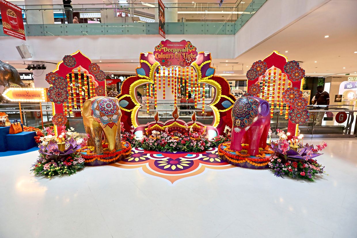 Gold and pink elephants flank the main Deepavali display at Sunway Putra Mall.