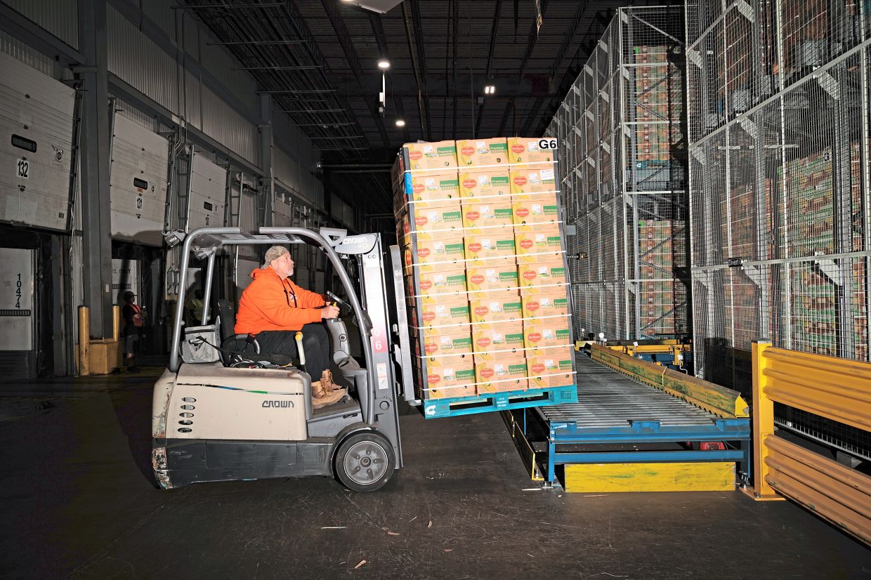 A cargo of bananas is transferred to a warehouse at the port in Gloucester City, New Jersey. Transporting bananas to the United States has become trickier since the conflict in Iran put pressure on global supply chains. — Hannah Beier/The New York Times