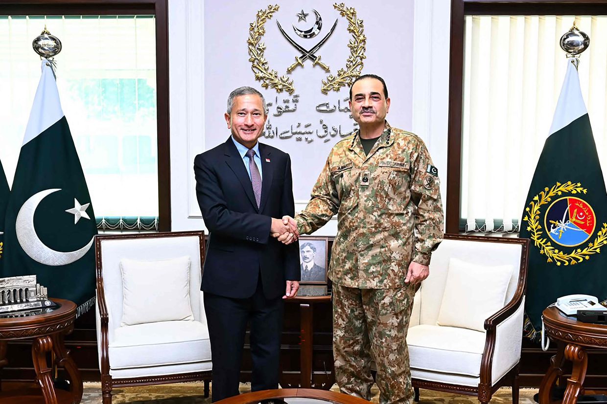 Pakistan Army Chief General Syed Asim Munir (right) shaking hands with Singapore's Foreign Minister Vivian Balakrishnan upon his arrival for a meeting in Rawalpindi. -- Photo by HANDOUT / Pakistan's Inter-Services Public Relations (ISPR) / AFP