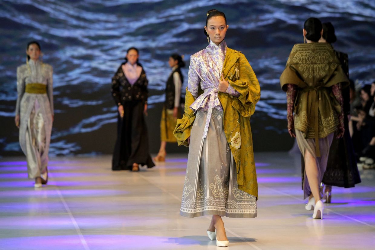 Models present a creation by Eri during Jakarta Fashion Week 2027 on Saturday, October 31, 2026. -- Photo by Lelananging Jagad / AFP