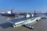 China says stealth attack drone makes first takeoff, landing on amphibious ship